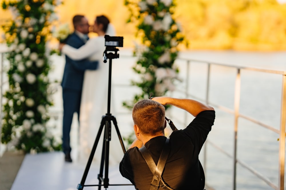 Photographer,Taking,Pictures,Of,The,Bride,And,Groom,At,The